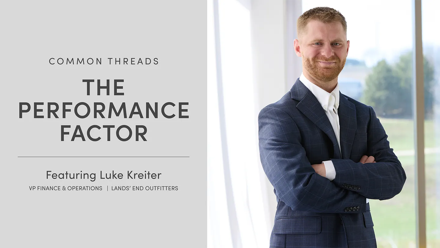 Two employees discussing notes.