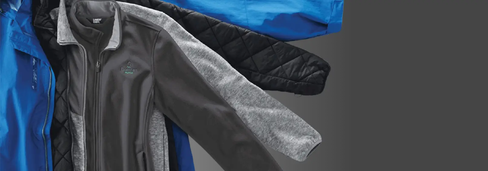 Layered outerwear stack highlighting different fleece jacket styles and shells