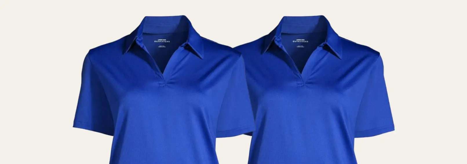 Two royal blue polo shirts on a tan background.