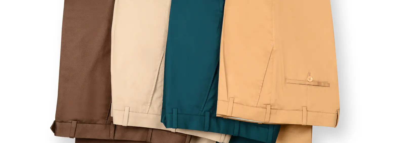 Four pairs of pants folded on a white background.