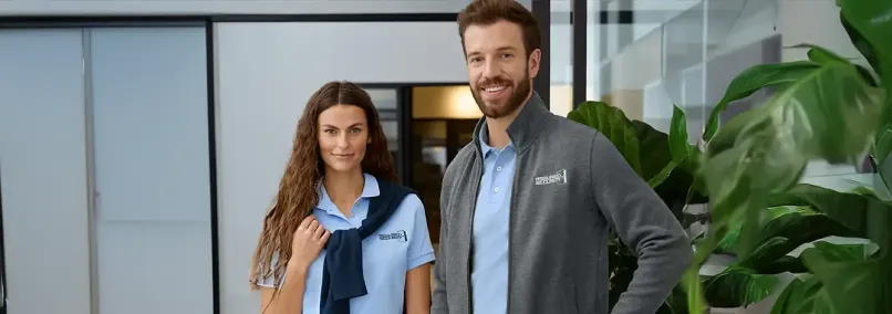 Professional attire featuring branded polo shirts and jackets.
