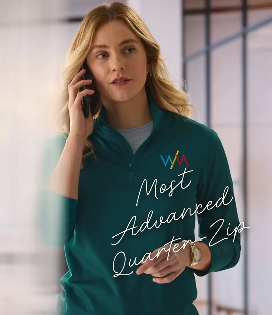 A woman wearing a green quarter zip.