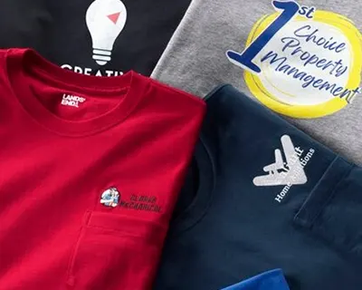 Several pieces of apparel laid over each other with different types of logo applications.