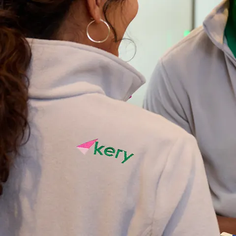 Back right shoulder logo placement on a fleece jacket.