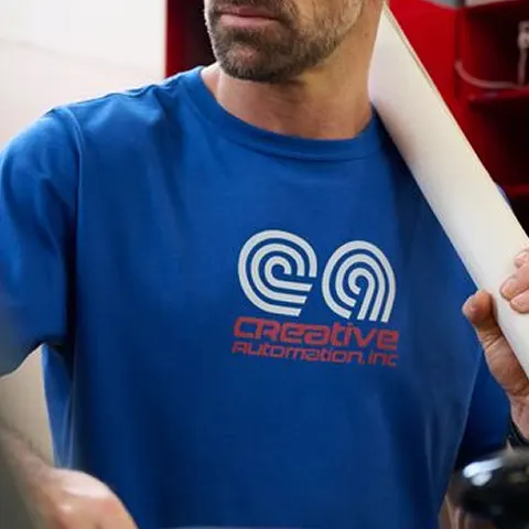 Mid chest logo placement on a blue t-shirt.