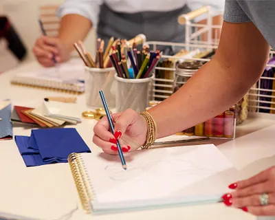 A designer drawing new clothing.