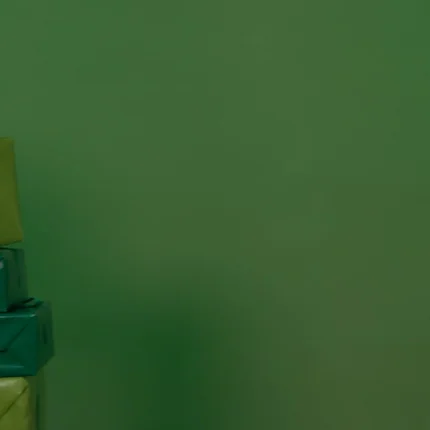 Employees sharing holiday gifts and wearing uniforms in assorted colors.