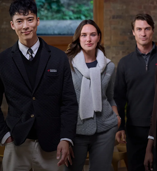 Employees wearing apparel from 2026 Fall/Holiday Collection