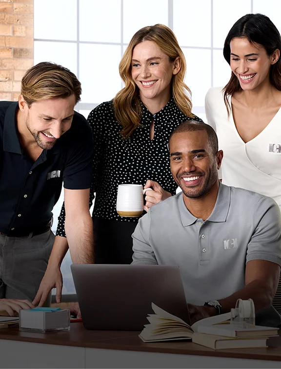 Employees wearing embroidered Supima cotton shirts.