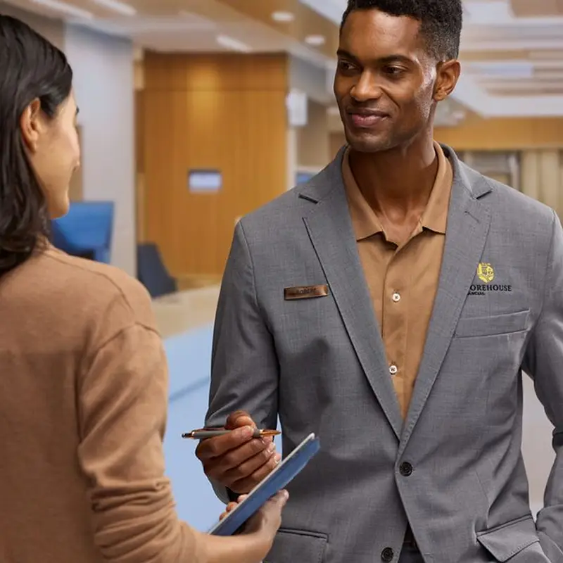 A financial organization employee signing papers.