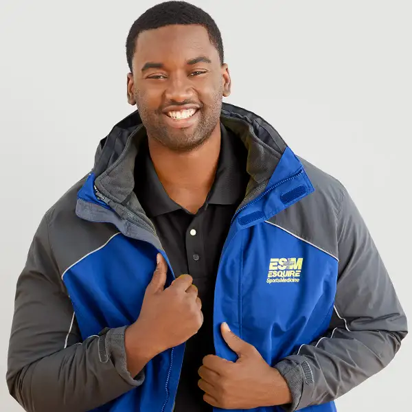 A man wearing a cobalt blue jacket.