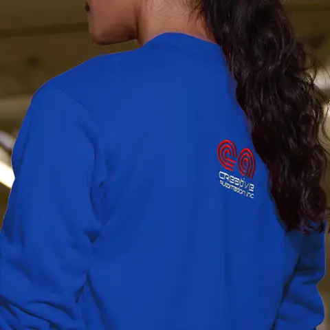 Mid upper back logo placement on a blue long sleeve top.