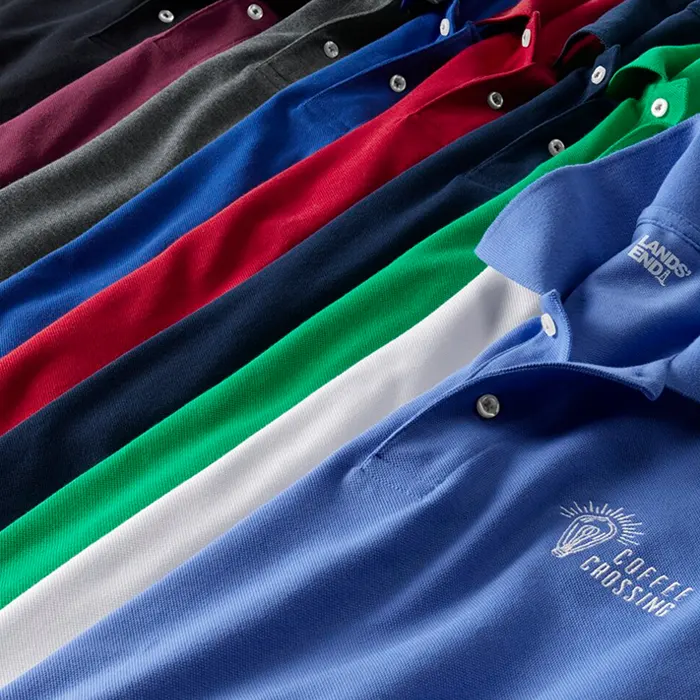 Polos of varying colors laid one ontop of the other.