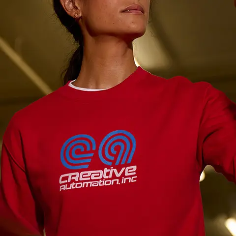 Mid chest logo placement example on a red shirt.