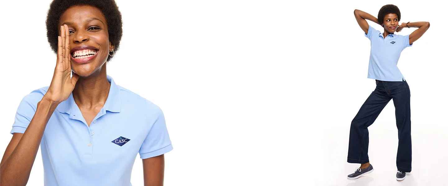 Woman wearing a blue signature supima polo.