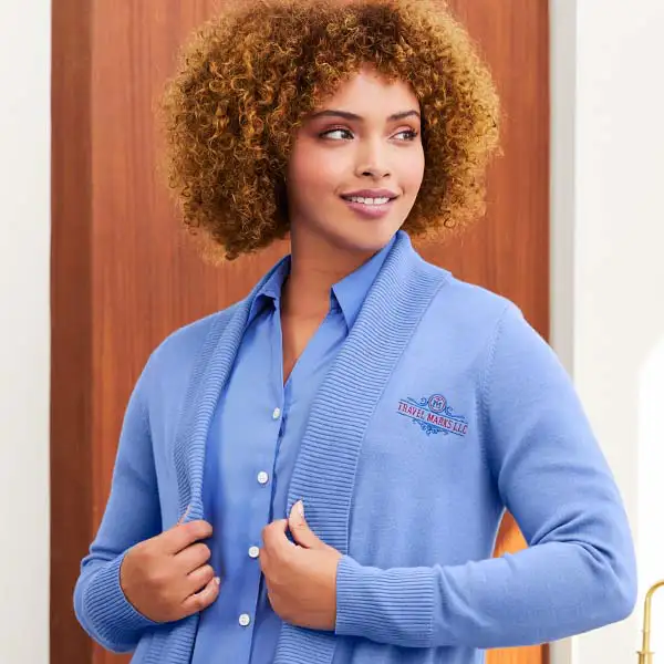 A woman wearing a light blue sweater.